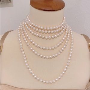 Extra long cultured pearl necklace.